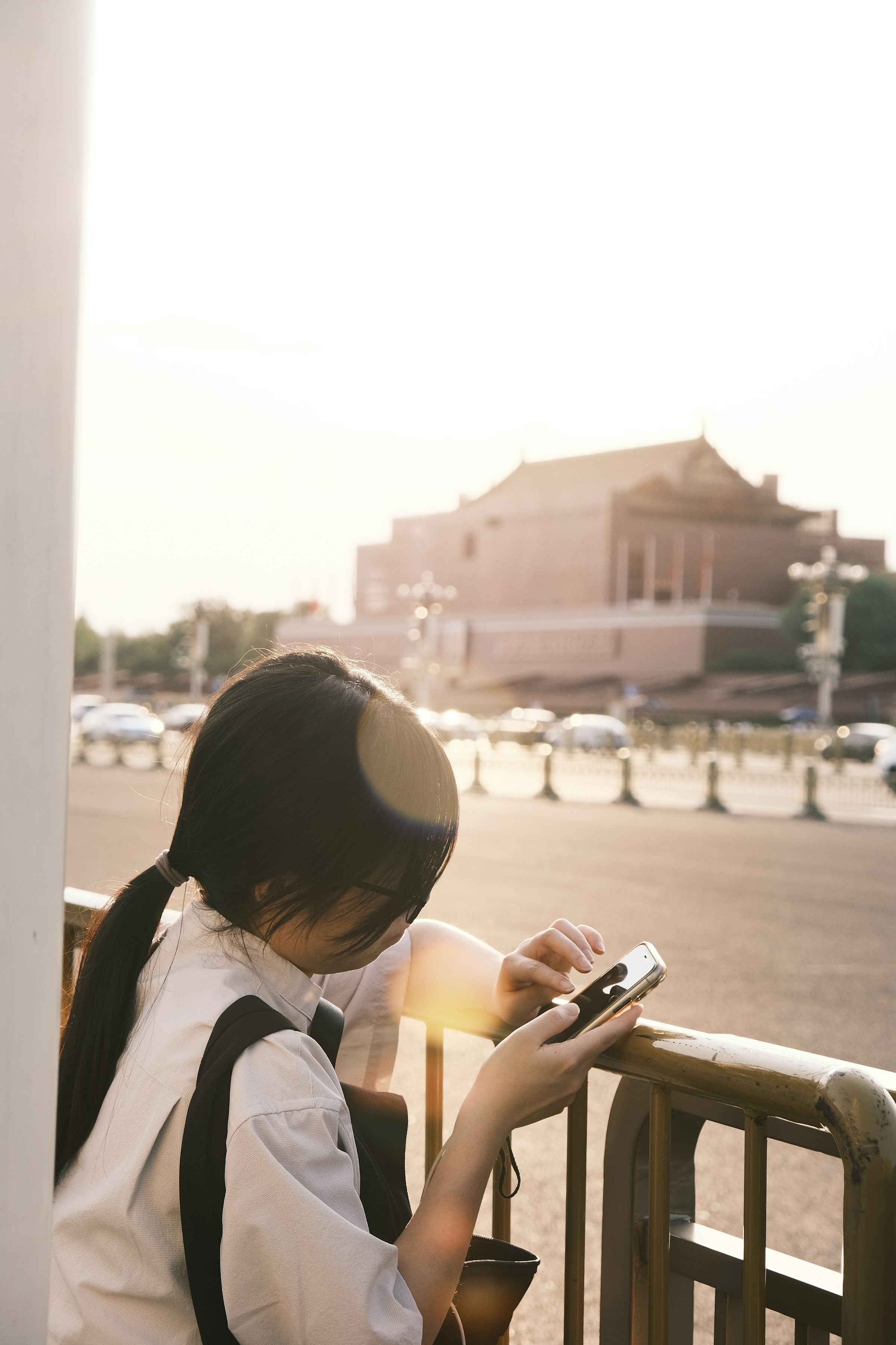 Person outdoors with a smartphone — while Locari works